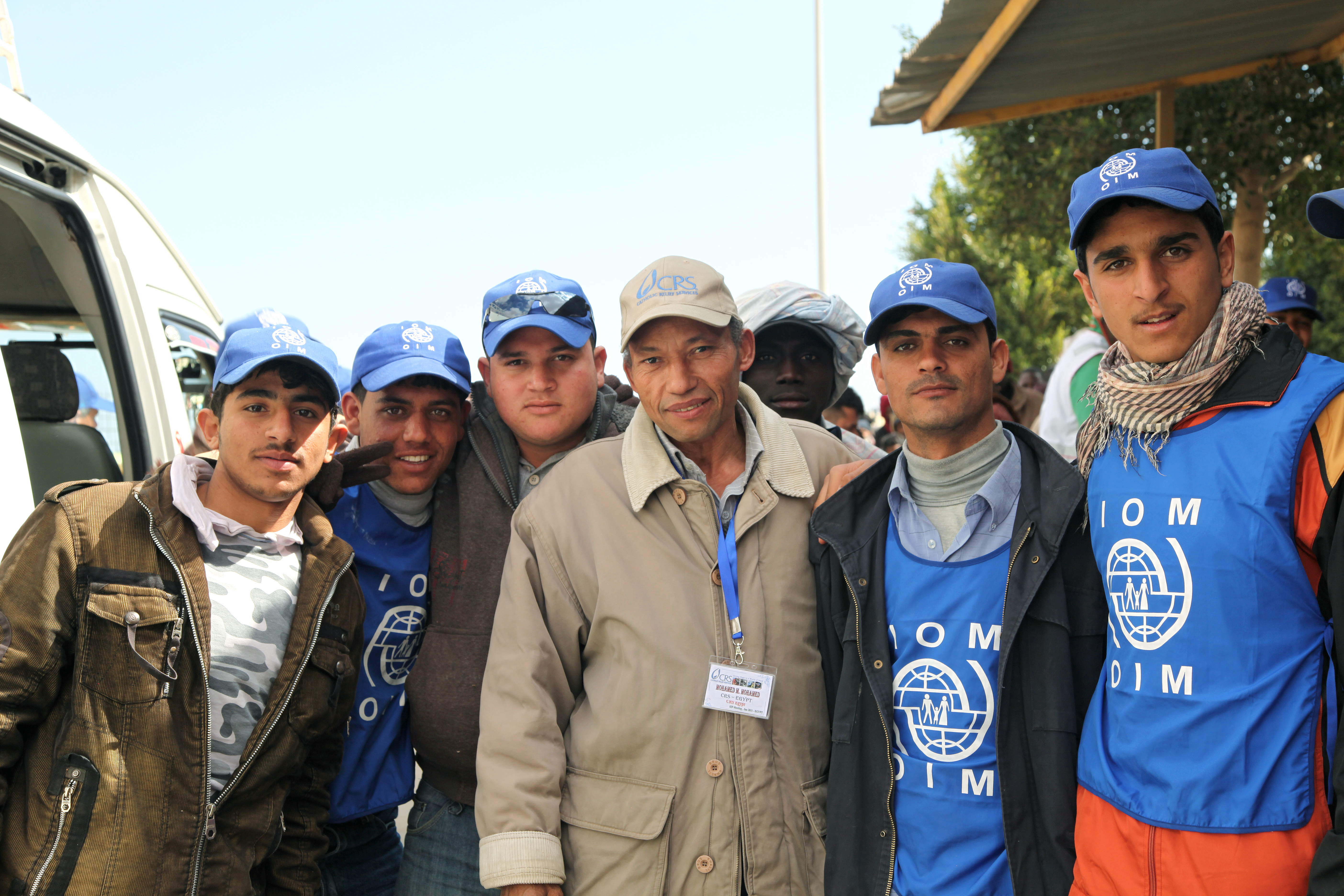 IOM un Migration. The United Nations Migration Agency. Volunteers assist Guests.